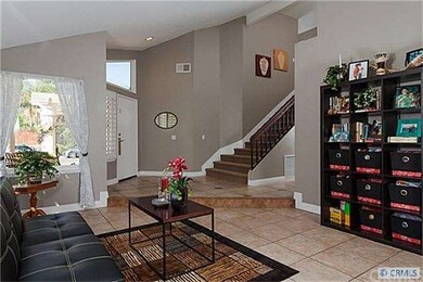 Entry, with ceramic tile floors  and custom base b