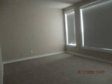 Master bedroom with wall of windows & walk in clos