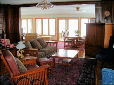 Living room looking to the 'river room' with views