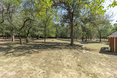 Beautiful trees throughout the 1.54 acres provide lots of shade!  This photo taken at 1pm!