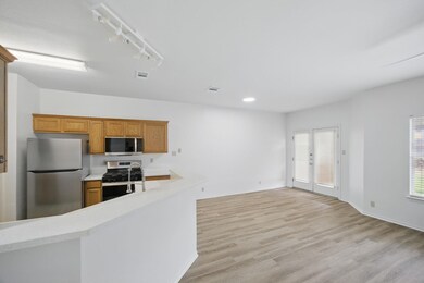 Kitchen with stainless steel appliances, light co