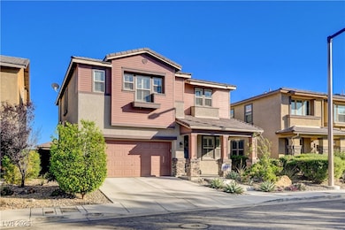 View of front of home with an attached garage, con