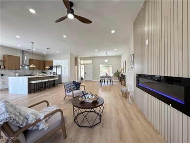 Living room featuring a ceiling fan, recessed ligh
