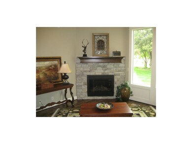 Inviting hearthroom, stone fireplace a focal point