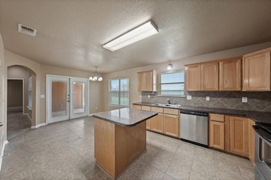 Kitchen with appliances with stainless steel fini