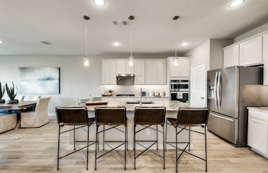 Eat in kitchen features large island *Model representation
