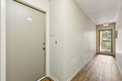 Unit 173 is conveniently located just steps from an exit door, offering ease of access while still feeling private and secure. The clean corridor leads directly to the entrance of your new home.