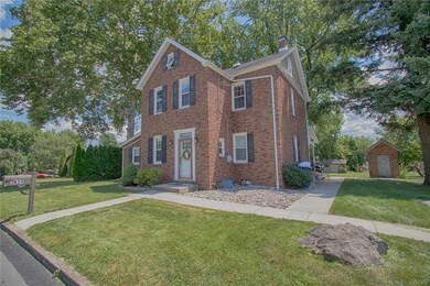 Front of home with newer sidewalk.