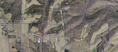 Aerial view of the property outlined in Red, showi