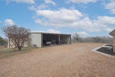 Garage has lots of storage including an enclosed storage room & enclosed pump room.