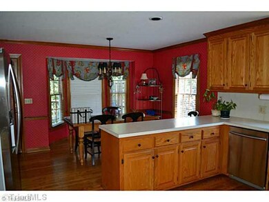 Kitchen. Large open Kitchen with breakfast area, hardwood floors, smooth ceilings and recessed lighting and bay window