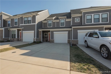 Townhome / multi-family property with a garage