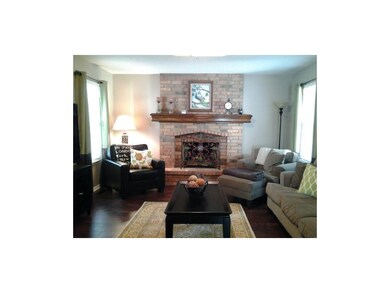 Engineered hardwood floors, brick fireplace, natur