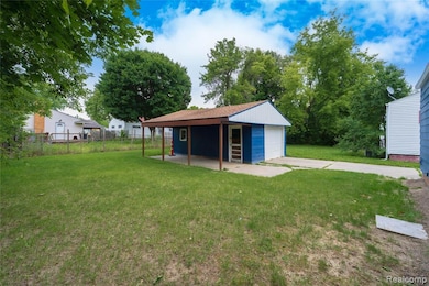 View of yard featuring an outbuilding and a detached garage
