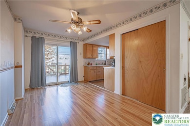 Main Level Dining room, Kitchen and Sliding door to the deck