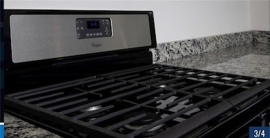 Detailed view of stainless steel range with gas s