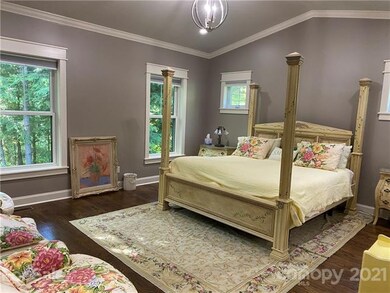 Master bedroom with views into the woods- complete