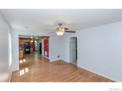 An alternate view of the living room, dining area,
