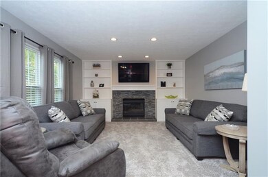 The spacious family room offers a gas fireplace wi