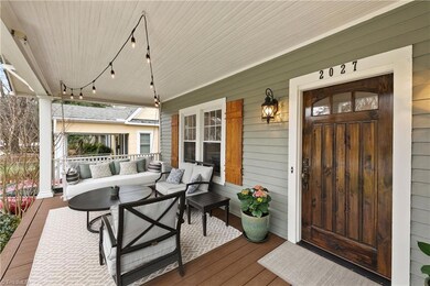 Cozy front porch where you can sit and greet your neighbors and friends.