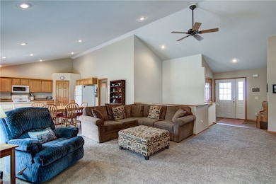 Living Room Photo w/ Entry Way and Kitchen In Back