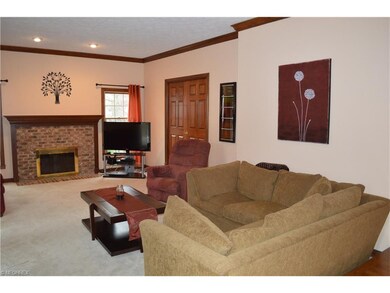 Family room with cozy fireplace, pocket doors lead