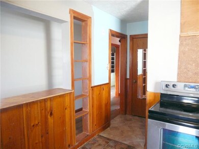 Kitchen looking into hall