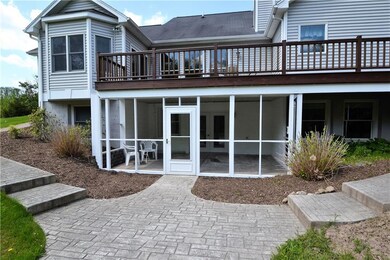 Rear of home with screened in porch.