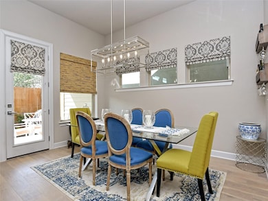 Dining space featuring wood finished floors and a