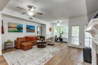 Living room featuring a ceiling fan, a high end f