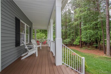 Wooden terrace featuring a lawn