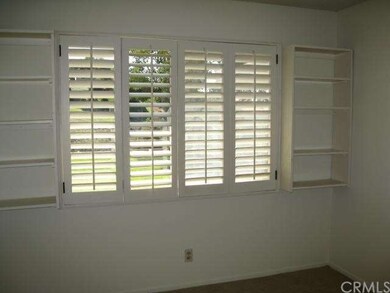Plantation shutters and bookcases in office/den/4t