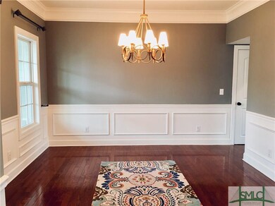 Gorgeous Formal Dining Room featuring  great details with wainscoting and deep moldings & trim work
