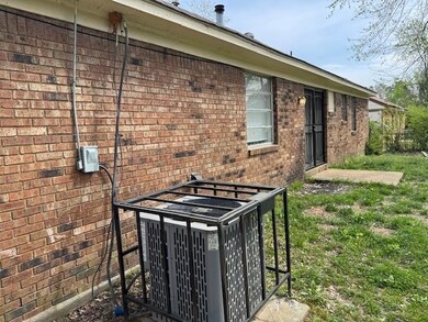 Details with brick siding and central AC unit