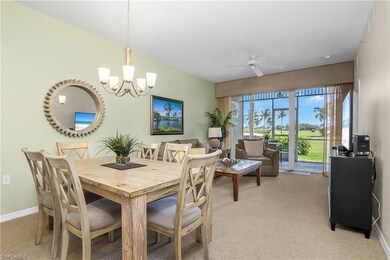 Dining area with ceiling fan with notable chandelier, visible vents, light colored carpet, and baseboards