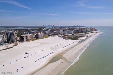Aerial view featuring a water view, a view of city