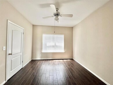 Spare room featuring dark wood-style floors, ceil