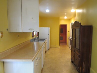 Kitchen has lots of counter space. Original metal cabinets very Retro.