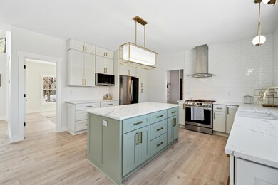 Stainless steel appliances, HUGE center island with plenty of storage and quartz countertops.