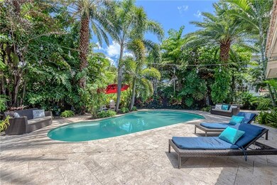 Gorgeous tropical backyard oasis with free form po