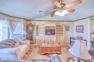 Living room with light wood-style flooring, a text