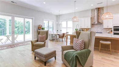 View of Family Room flowing gracefully into breakfast eating area
