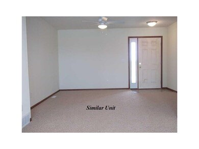 Living Room. Picture is of Similar Unit.