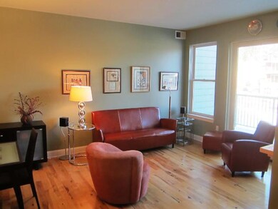The living room has a huge Andersen Window patio d