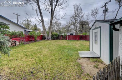 View of yard with an outbuilding, a storage unit, 