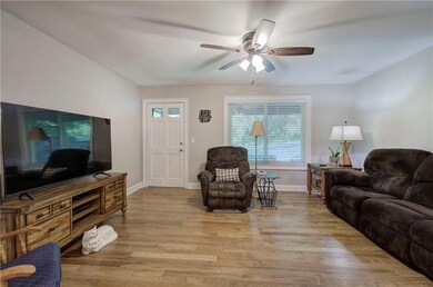Living room features traditional hardwood flooring
