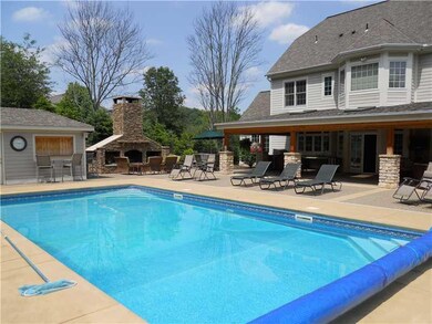 Exterior Back. Swimming pool is 36 x 18 and is sha