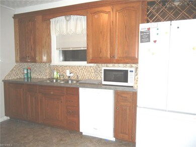 Side of kitchen showing wine rack and dishwasher