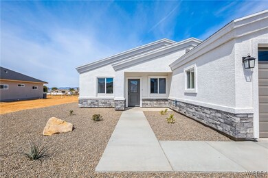 View of front of property featuring stucco siding