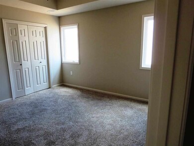 Master Bedroom with his and her closets. Walk-in closet is a concrete safe room.